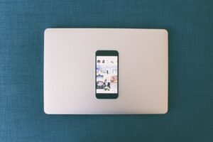 Smartphone on laptop showing social media — what happens to your digital accounts when you die